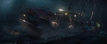 Movie still from “Tomb Raider” (2018), directed by Roar Uthaug – A boat in the middle of the ocean on a rainy night; Extreme Wide shot, High angle
