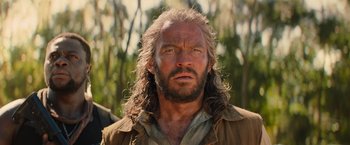 Movie still from “Tomb Raider” (2018), directed by Roar Uthaug – A person with long hair; Close Up shot, Low angle