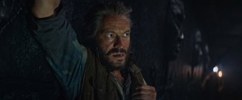 Movie still from “Tomb Raider” (2018), directed by Roar Uthaug – A person with a beard; Close Up shot, High angle