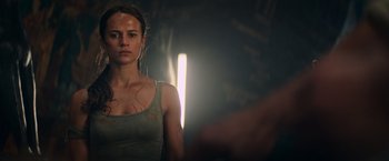 Movie still from “Tomb Raider” (2018), directed by Roar Uthaug – A person in a dark room; Close Up shot, Low angle