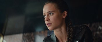 Movie still from “Tomb Raider” (2018), directed by Roar Uthaug – A person with a braid; Close Up shot, Low angle