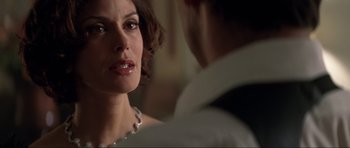 Movie still from “Tomorrow Never Dies” (1997), directed by Roger Spottiswoode – A man and a woman looking at one another; Close Up shot, Over the shoulder angle