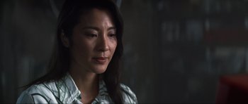 Movie still from “Tomorrow Never Dies” (1997), directed by Roger Spottiswoode – A person with long hair; Close Up shot, Over the shoulder angle