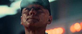 Movie still from “Top Gun” (1986), directed by Tony Scott – A person wearing a hat; Close Up shot, Low angle