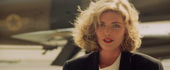 Movie still from “Top Gun” (1986), directed by Tony Scott – A person wearing a jacket; Close Up shot, Over the shoulder angle
