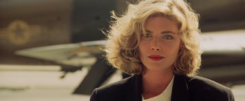 Movie still from “Top Gun” (1986), directed by Tony Scott – A person wearing a jacket; Close Up shot, Over the shoulder angle