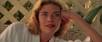 Movie still from “Top Gun” (1986), directed by Tony Scott – A person with a hand on her head; Close Up shot, Low angle