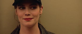 Movie still from “Top Gun” (1986), directed by Tony Scott – A person wearing a hat; Close Up shot, Over the shoulder angle