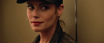 Movie still from “Top Gun” (1986), directed by Tony Scott – A person wearing a hat; Close Up shot, Over the shoulder angle