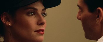 Movie still from “Top Gun” (1986), directed by Tony Scott – A person wearing a hat; Close Up shot, Over the shoulder angle