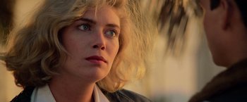 Movie still from “Top Gun” (1986), directed by Tony Scott – A person with blonde hair; Close Up shot, Low angle