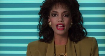 Movie still from “Total Recall” (1990), directed by Paul Verhoeven – A person with long hair; Close Up shot, Low angle