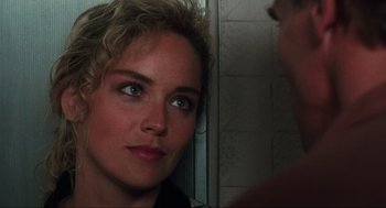 Movie still from “Total Recall” (1990), directed by Paul Verhoeven – A person looking at the camera; Close Up shot, Over the shoulder angle