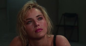 Movie still from “Total Recall” (1990), directed by Paul Verhoeven – A person with wet hair; Close Up shot, Over the shoulder angle