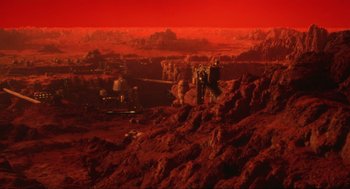 Movie still from “Total Recall” (1990), directed by Paul Verhoeven – An image of a red planet in the middle of the night; Extreme Wide shot, High angle