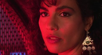 Movie still from “Total Recall” (1990), directed by Paul Verhoeven – A woman's face in red light; Close Up shot, Low angle