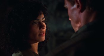 Movie still from “Total Recall” (1990), directed by Paul Verhoeven – A man and a woman looking at one another; Close Up shot, Over the shoulder angle