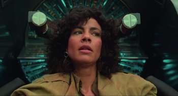 Movie still from “Total Recall” (1990), directed by Paul Verhoeven – A person with curly hair; Close Up shot, Low angle