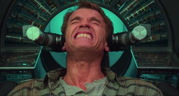 Movie still from “Total Recall” (1990), directed by Paul Verhoeven – A man with two telephones attached to his ears; Close Up shot, Overhead angle