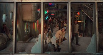 Movie still from “Total Recall” (1990), directed by Paul Verhoeven – A group of people walking down a street; Wide shot, High angle