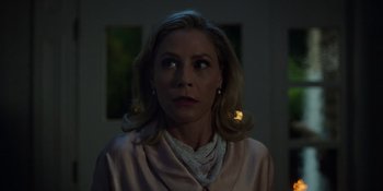 Movie still from “Totally Killer” (2023), directed by Nahnatchka Khan – A woman in a pink robe stares into the distance; Close Up shot, Over the shoulder angle