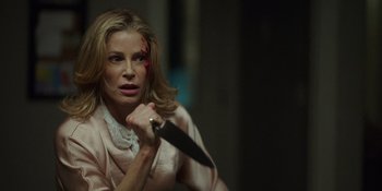 Movie still from “Totally Killer” (2023), directed by Nahnatchka Khan – A woman holding a knife with blood all over her face; Close Up shot, Over the shoulder angle