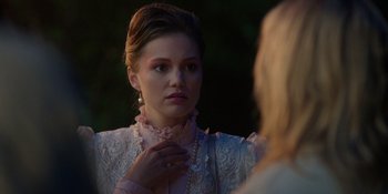 Movie still from “Totally Killer” (2023), directed by Nahnatchka Khan – A young woman looking at herself in the mirror; Close Up shot, Over the shoulder angle