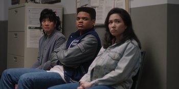 Movie still from “Totally Killer” (2023), directed by Nahnatchka Khan – A group of young people sitting next to each other; Medium shot, High angle