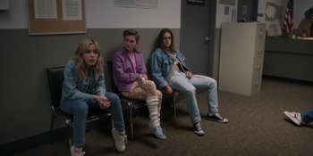 Movie still from “Totally Killer” (2023), directed by Nahnatchka Khan – A group of young people sitting on a bench; Medium shot, High angle