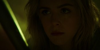 Movie still from “Totally Killer” (2023), directed by Nahnatchka Khan – A woman's face in the dark; Close Up shot, Low angle