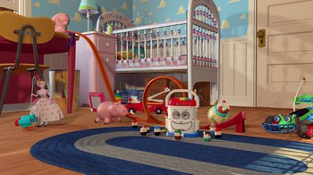 Movie still from “Toy Story” (1995), directed by John Lasseter – A toy room with toys and a baby crib in the background; Extreme Wide shot, High angle