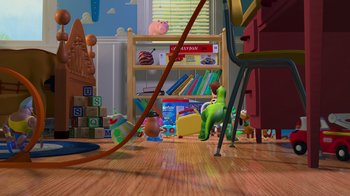 Movie still from “Toy Story” (1995), directed by John Lasseter – A toy story scene with a toy story character and other toys; Extreme Wide shot, High angle