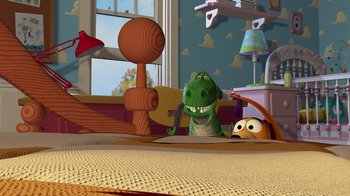 Movie still from “Toy Story” (1995), directed by John Lasseter – A green t - rex sitting on top of a wooden table; Extreme Wide shot, High angle