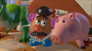Movie still from “Toy Story” (1995), directed by John Lasseter – A toy story character with a pig and a cactus; Close Up shot, High angle