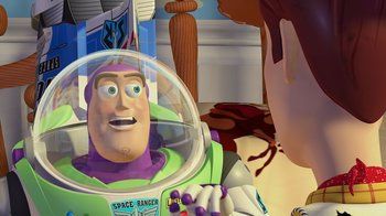 Movie still from “Toy Story” (1995), directed by John Lasseter – A man in a space ranger helmet looking at a person in a spacesuit in a room; Close Up shot, Over the shoulder angle