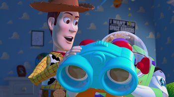Movie still from “Toy Story” (1995), directed by John Lasseter – A toy story character holding a toy binoculars; Medium shot, Over the shoulder angle