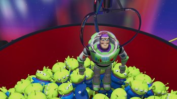 Movie still from “Toy Story” (1995), directed by John Lasseter – A toy story character standing in front of a group of aliens; Wide shot, High angle