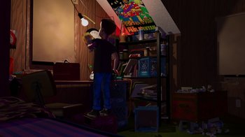 Movie still from “Toy Story” (1995), directed by John Lasseter – A person standing in a room with a book shelf in front of him; Wide shot, High angle