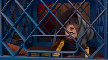 Movie still from “Toy Story” (1995), directed by John Lasseter – A person in a cage; Wide shot, High angle