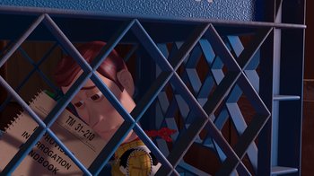 Movie still from “Toy Story” (1995), directed by John Lasseter – A toy story character is behind a fence; Medium shot, High angle