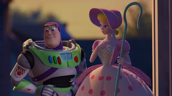 Movie still from “Toy Story 2” (1999), directed by Lee Unkrich – A couple of people standing next to each other; Medium shot, Over the shoulder angle