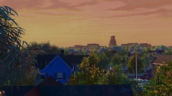 Movie still from “Toy Story 2” (1999), directed by Lee Unkrich – A view of a city skyline from a distance at sunset; Extreme Wide shot, Low angle