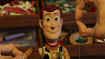 Movie still from “Toy Story 2” (1999), directed by Lee Unkrich – A toy story woody doll; Close Up shot, Over the shoulder angle