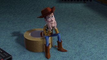 Movie still from “Toy Story 2” (1999), directed by Lee Unkrich – A toy story character sitting on the ground; Wide shot, Low angle