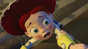 Movie still from “Toy Story 2” (1999), directed by Lee Unkrich – A toy story character laying on top of a table; Close Up shot, Low angle