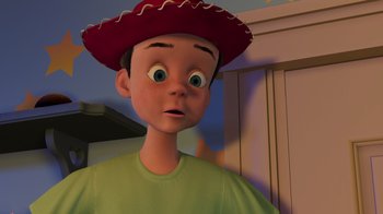Movie still from “Toy Story 2” (1999), directed by Lee Unkrich – A boy wearing a red hat and a green shirt; Close Up shot, Low angle