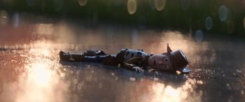Movie still from “Toy Story 4” (2019), directed by Josh Cooley – A toy is laying on the ground in the sunlight; Wide shot, Low angle