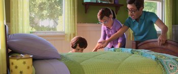 Movie still from “Toy Story 4” (2019), directed by Josh Cooley – A woman and a child playing a game on a bed; Medium shot, Over the shoulder angle