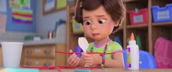 Movie still from “Toy Story 4” (2019), directed by Josh Cooley – A little girl is holding a spoon in her hands; Close Up shot, Over the shoulder angle