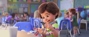 Movie still from “Toy Story 4” (2019), directed by Josh Cooley – A little girl is holding a pair of scissors; Medium shot, Over the shoulder angle